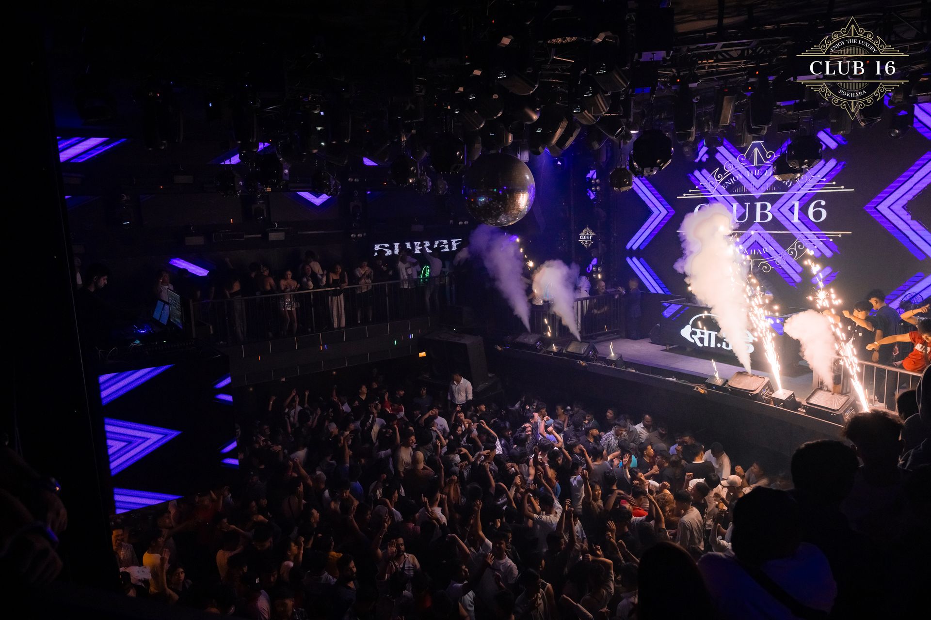 Fire dancer in blue spotlight